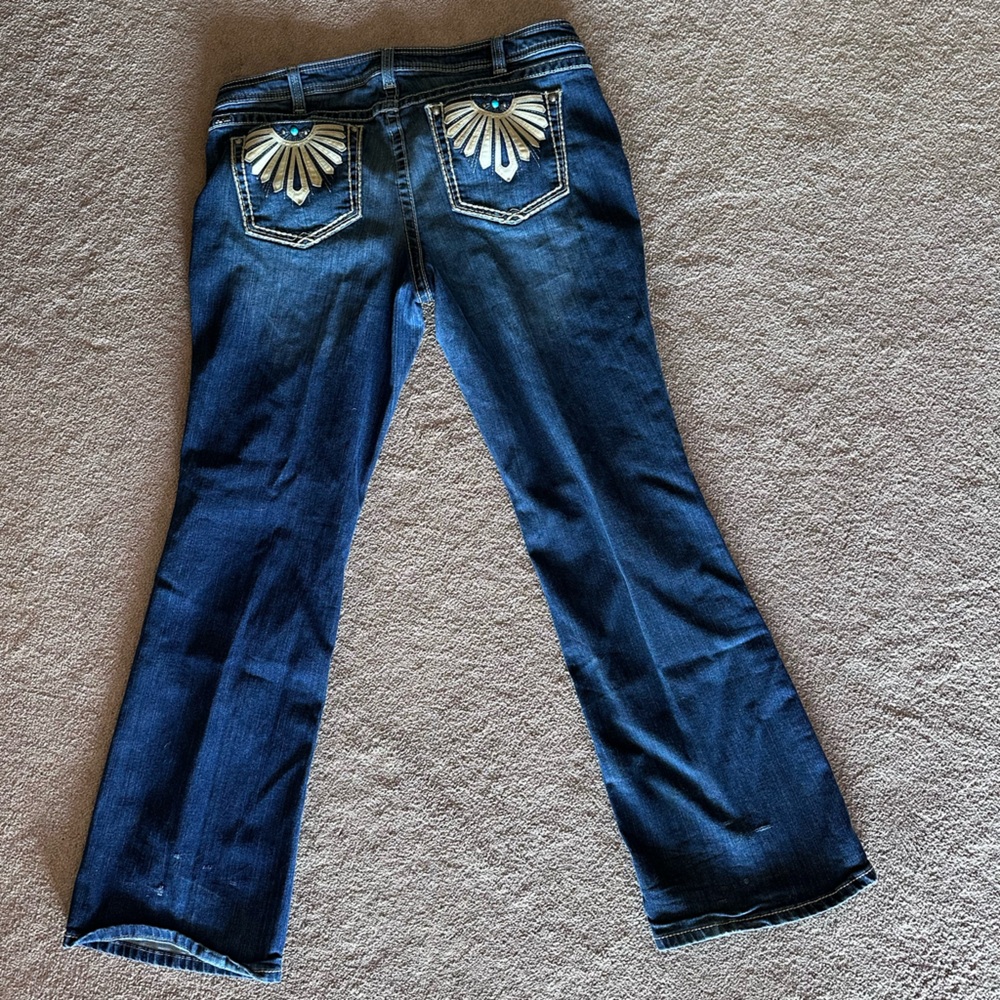 Women’s Ariat Dark Blue Flare Jeans with leather and turquoise pocket accents